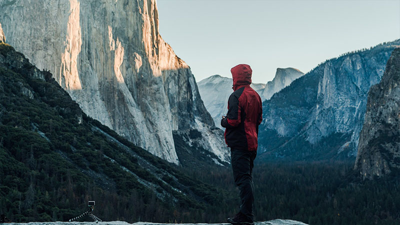 person stood on snowy mountain