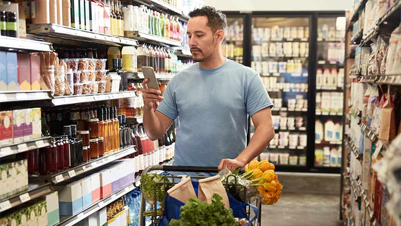 man shopping with trolley